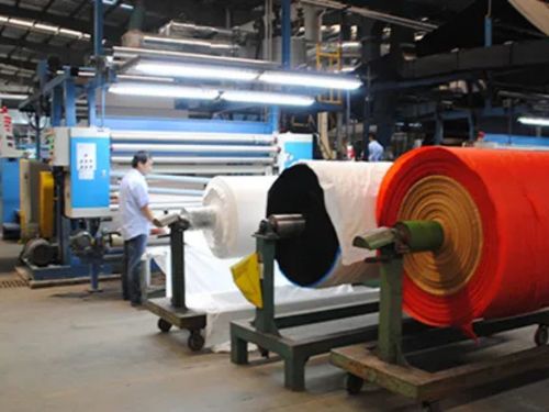 Textile factory, fabric rolls, weaving machines